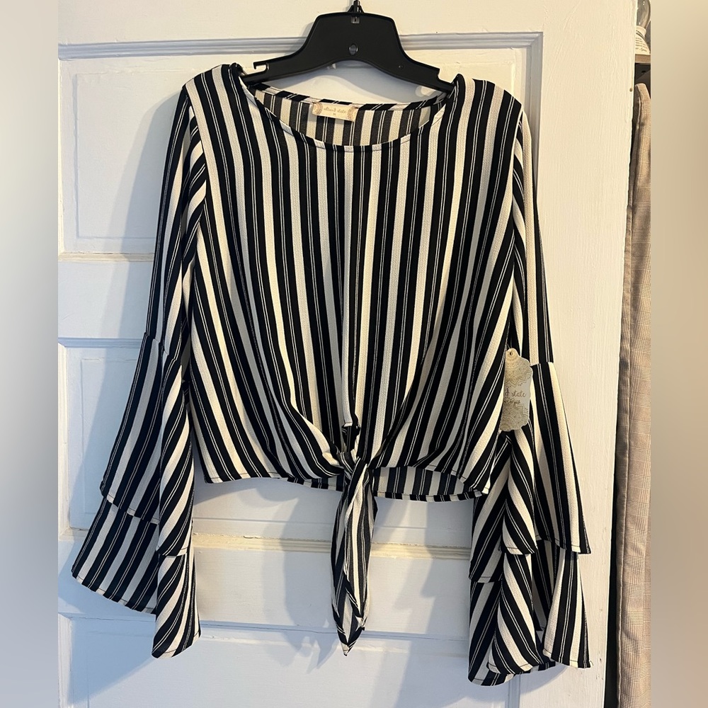 Black and white  bell sleeved crop top. Brand new with tags size medium.